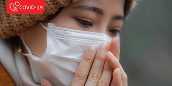 Asian woman wearing a respiratory protection mask
